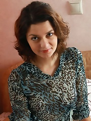 Petite curly brunette teen with perfectly shaved pussy