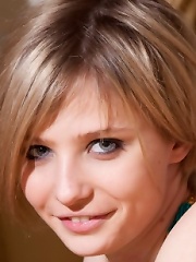 Sexy teen posing nude in her bed before going to sleep