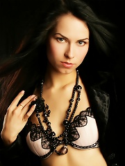 Sultry babe with lustrious black hair and hypnotic eyes.