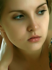 Petite cutie with nubile body and puffy breasts.