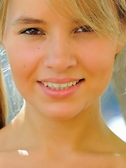 Blonde pigtail teen using four fingers